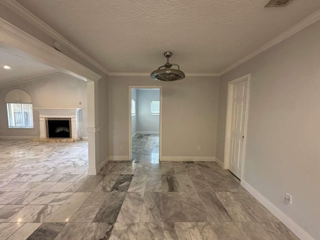 interior space with crown molding and a textured ceiling