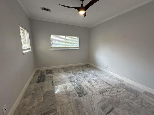 empty room with ceiling fan and ornamental molding