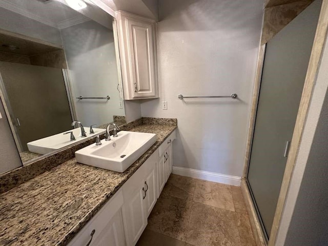 bathroom with walk in shower, crown molding, and vanity