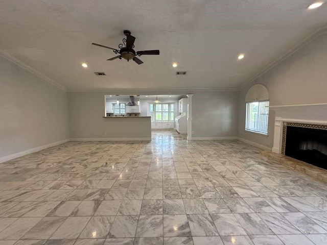 unfurnished living room with ceiling fan and crown molding