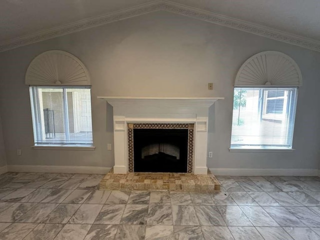 unfurnished living room with ornamental molding, lofted ceiling, and a tile fireplace