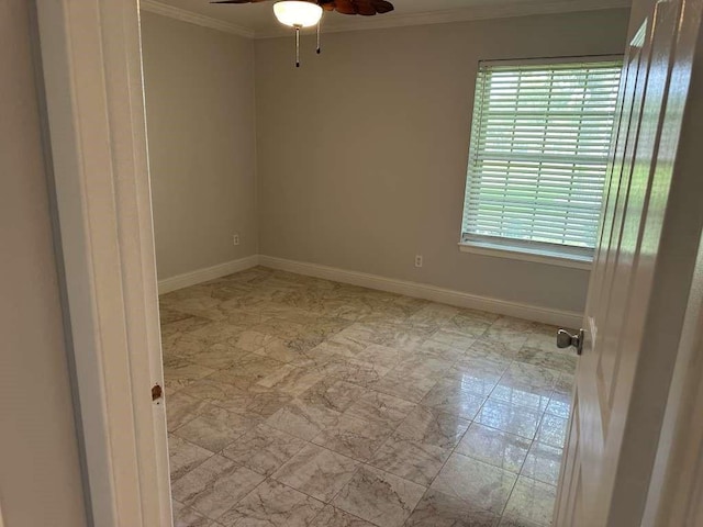 spare room with ceiling fan and ornamental molding