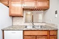 kitchen featuring dishwasher and sink