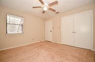 unfurnished bedroom with ceiling fan