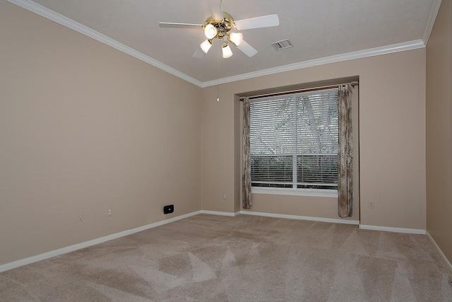 unfurnished room with ornamental molding, light carpet, and ceiling fan