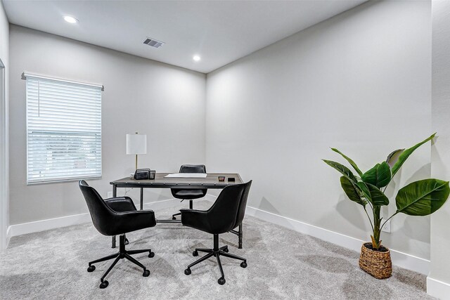 office area featuring light carpet