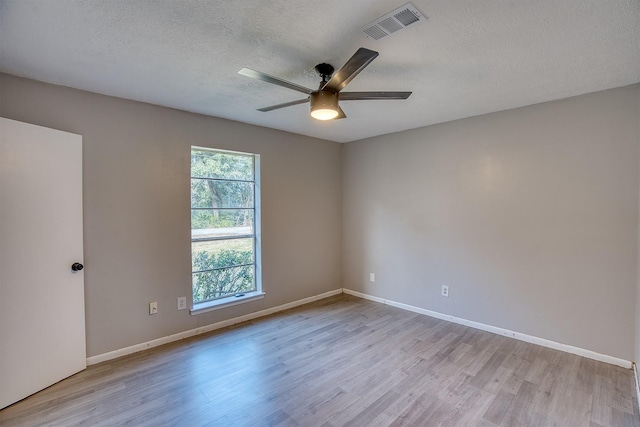 unfurnished room featuring ceiling fan, a textured ceiling, and light hardwood / wood-style flooring