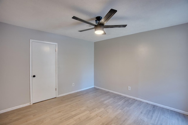 unfurnished room featuring a textured ceiling, ceiling fan, and light hardwood / wood-style floors