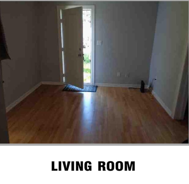 empty room with hardwood / wood-style floors