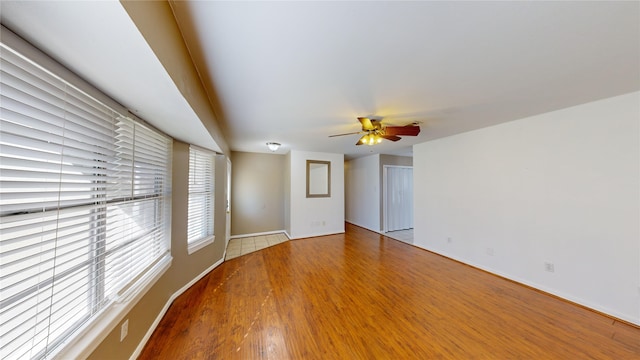 unfurnished room featuring ceiling fan and wood-type flooring