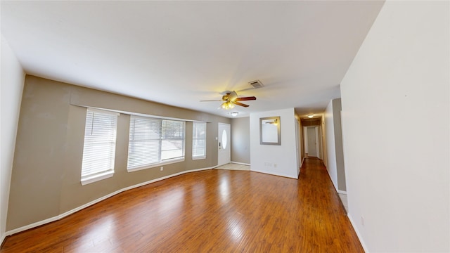 22306 Rustic Bridge Ln, Houston, TX 77339 - unfurnished room with wood finished floors, ceiling fan, and baseboards
