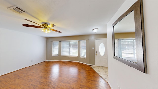 foyer featuring ceiling fan and light wood-type flooring