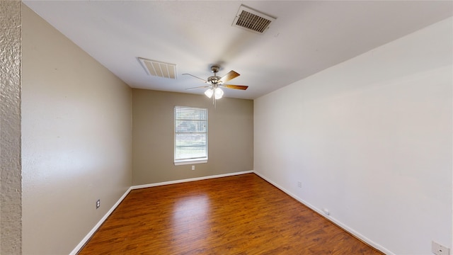 spare room featuring ceiling fan and hardwood / wood-style floors