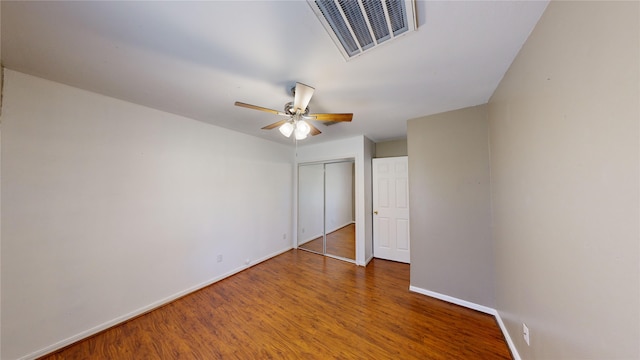 unfurnished bedroom featuring ceiling fan and hardwood / wood-style flooring