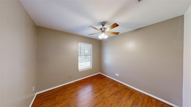 unfurnished room featuring ceiling fan and hardwood / wood-style floors