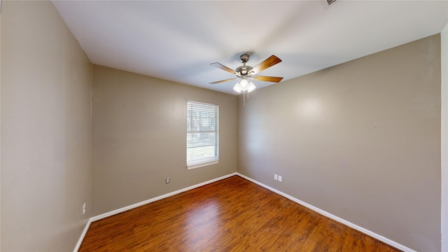 empty room with ceiling fan and wood-type flooring