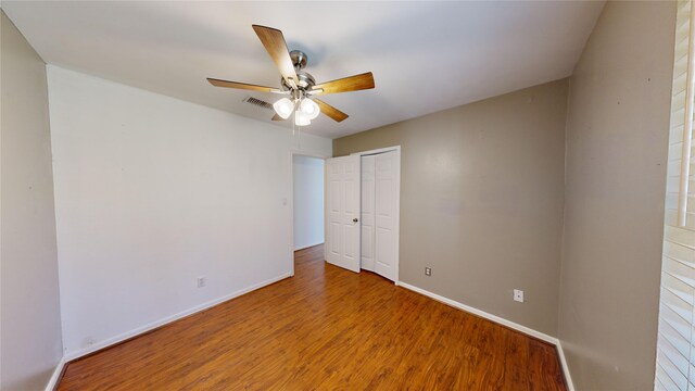 22306 Rustic Bridge Ln, Houston, TX 77339 - spare room with wood finished floors, baseboards, and a ceiling fan