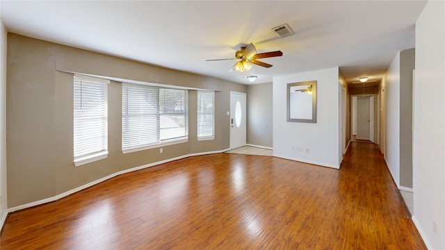 22306 Rustic Bridge Ln, Houston, TX 77339 - spare room with attic access, ceiling fan, wood finished floors, and baseboards