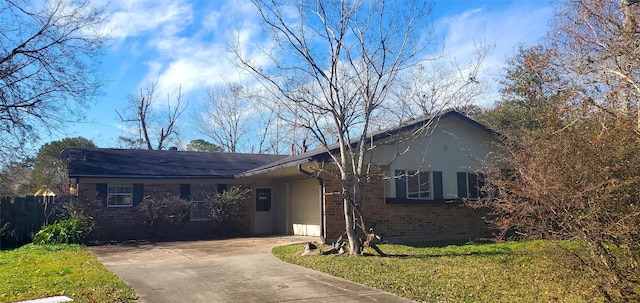 ranch-style house with a garage and a front yard