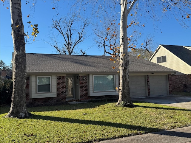 ranch-style home with a garage and a front yard