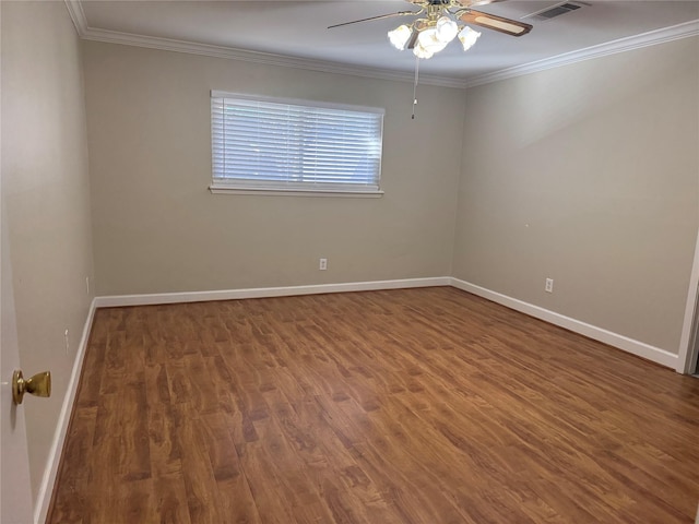 empty room with ceiling fan, crown molding, and hardwood / wood-style floors