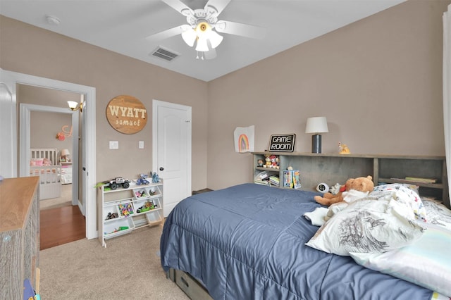 bedroom with ceiling fan and carpet flooring