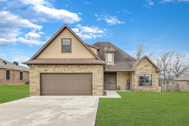 view of front of house featuring a garage and a front lawn