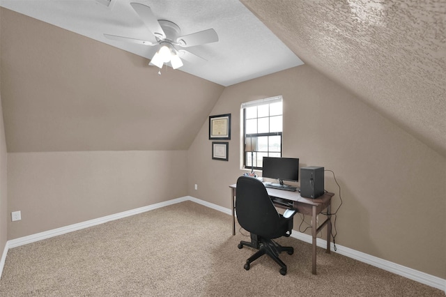 office area with a textured ceiling, ceiling fan, carpet flooring, and lofted ceiling