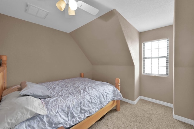 bedroom with light carpet, ceiling fan, and lofted ceiling