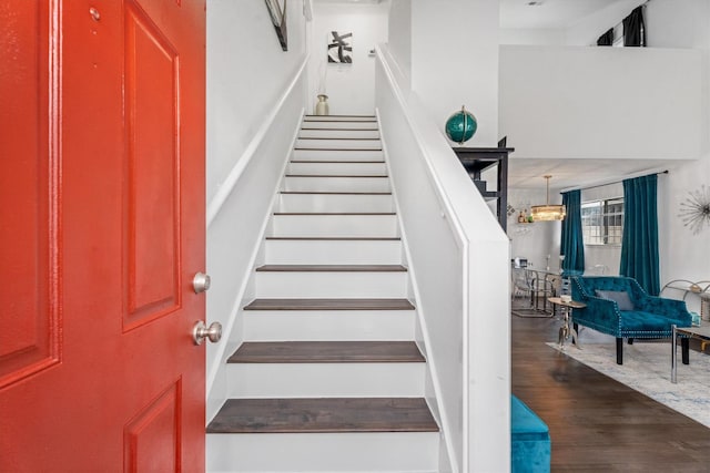 staircase featuring hardwood / wood-style flooring