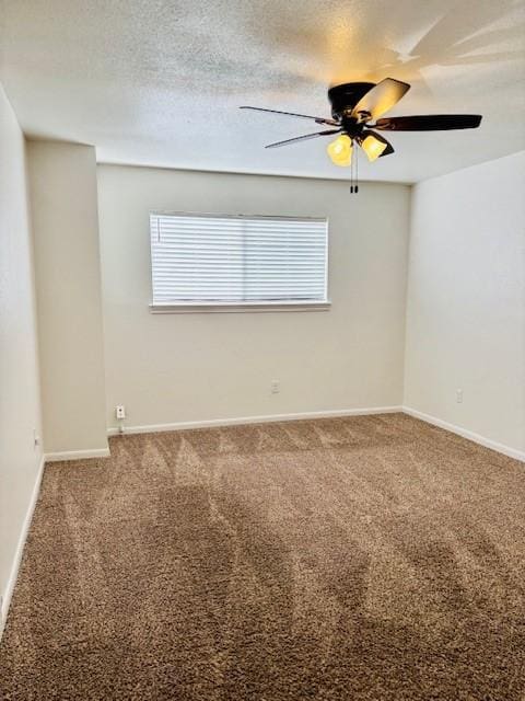 empty room featuring ceiling fan, a textured ceiling, and carpet flooring