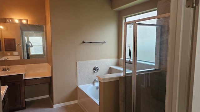 full bath featuring a garden tub, a healthy amount of sunlight, a shower stall, and vanity