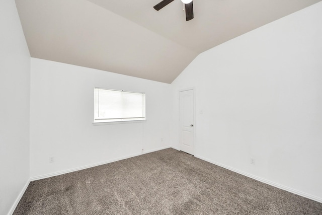 unfurnished room with ceiling fan, carpet, and lofted ceiling