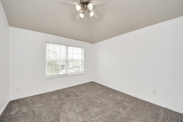 unfurnished room featuring ceiling fan, vaulted ceiling, and carpet floors