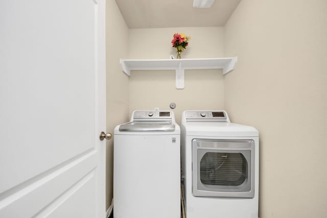 laundry room featuring washing machine and dryer