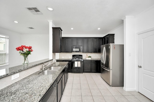 kitchen featuring black appliances, light stone countertops, light tile patterned floors, sink, and ornamental molding