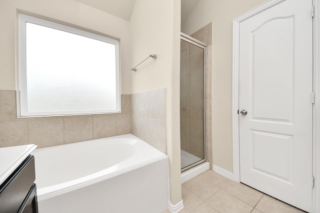 bathroom featuring separate shower and tub, tile patterned flooring, and vanity