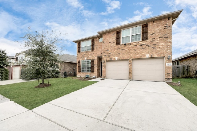 view of front of house featuring a garage and a front yard