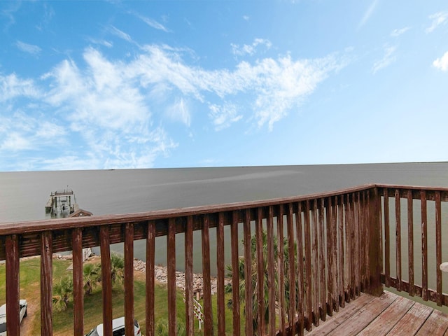 wooden deck featuring a water view