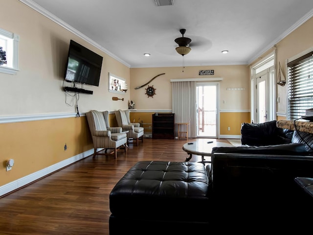 living room featuring ceiling fan, dark hardwood / wood-style flooring, and ornamental molding