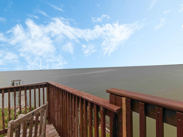 wooden deck featuring a water view