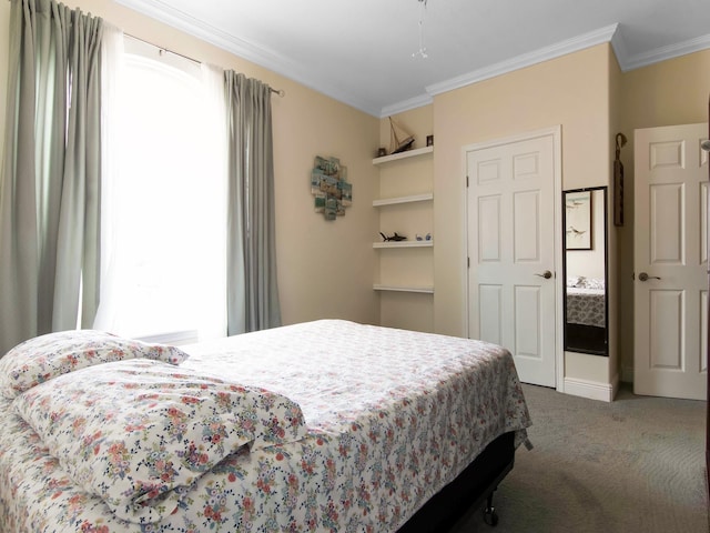 bedroom with carpet floors and ornamental molding