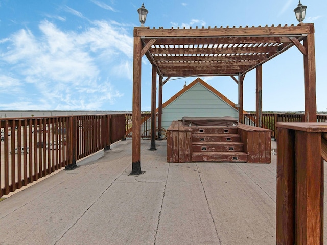 view of patio with a hot tub and a pergola