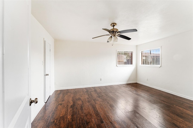 spare room featuring ceiling fan and dark hardwood / wood-style floors