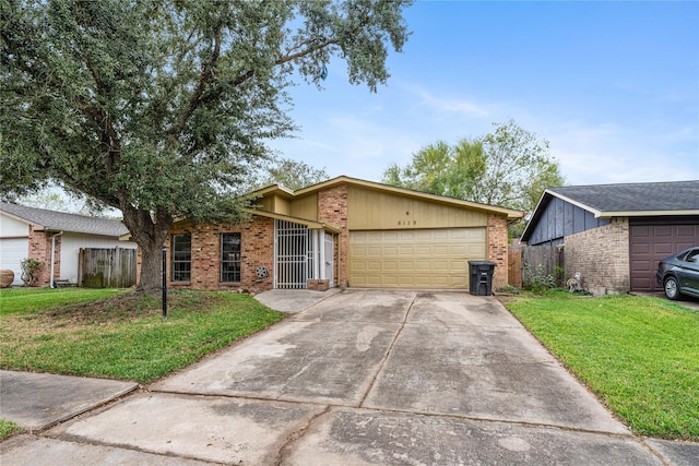 single story home featuring a front yard and a garage