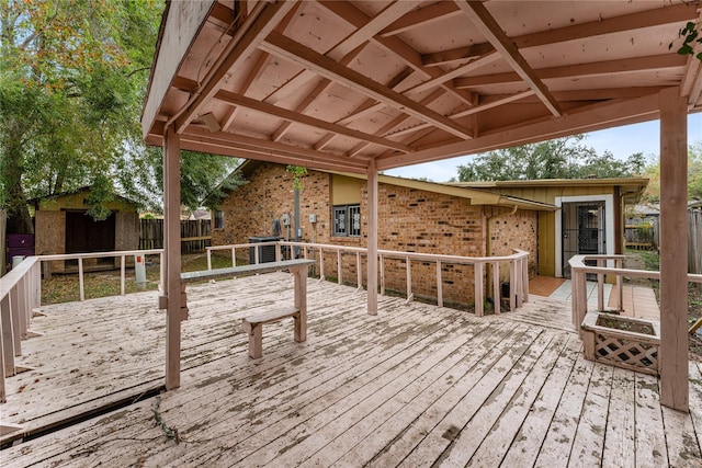 wooden deck with a storage unit