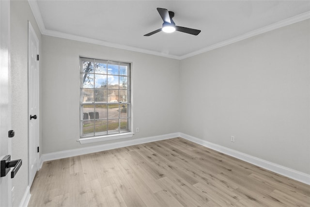 empty room with ceiling fan, ornamental molding, and light wood-type flooring