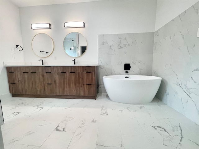 bathroom with vanity and a bathtub