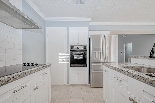 kitchen with sink, crown molding, black appliances, wall chimney range hood, and white cabinets