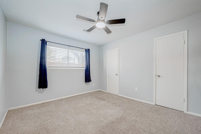 unfurnished room featuring carpet flooring and ceiling fan